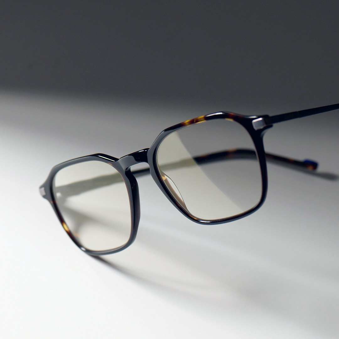 Image of glasses with grey background.