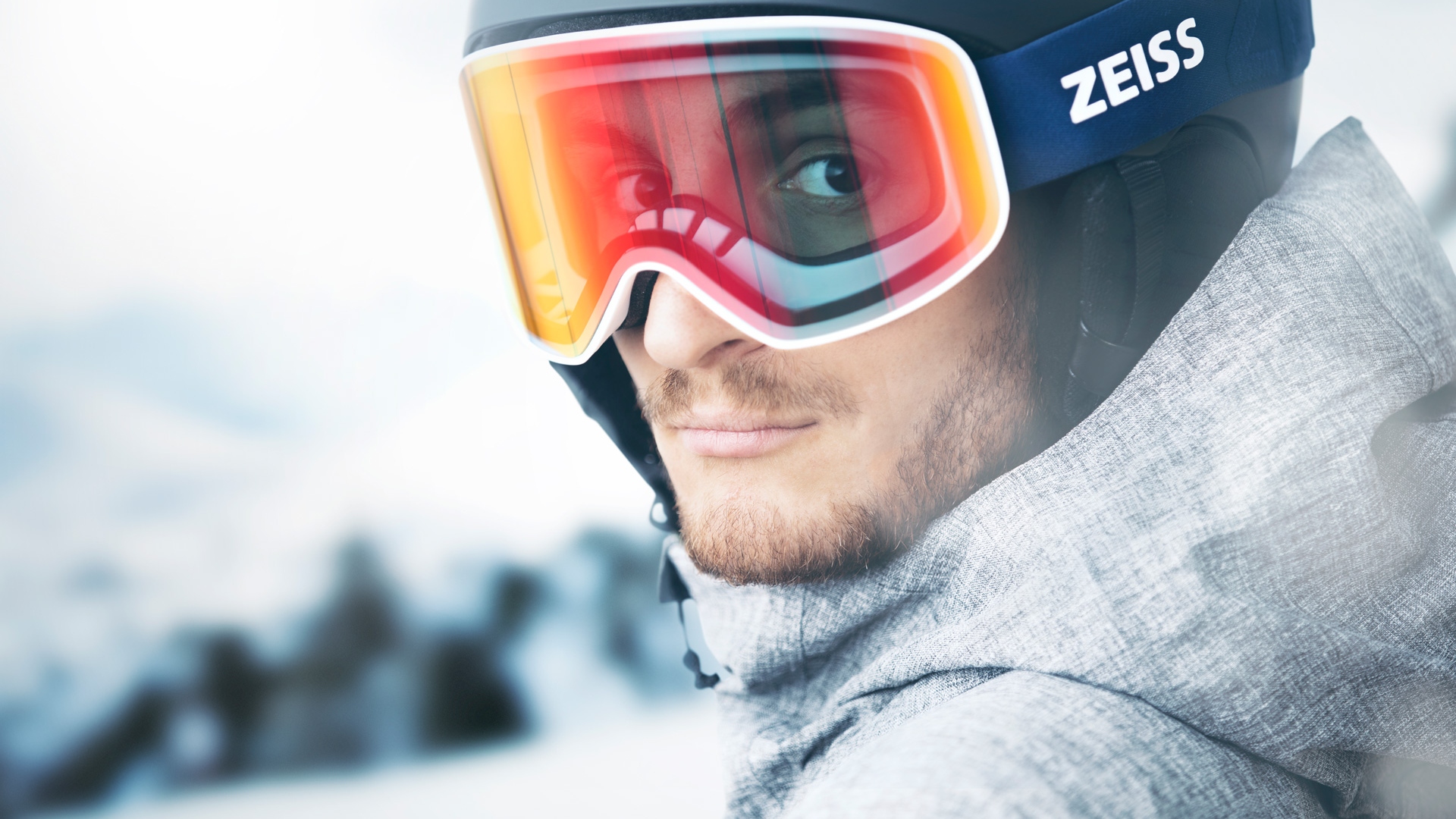 A man wearing ZEISS ski goggles